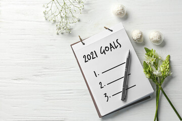 Notebook with empty to-do list for 2021 year on white wooden background