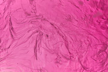 macro photography of oil on water in lilac tones
