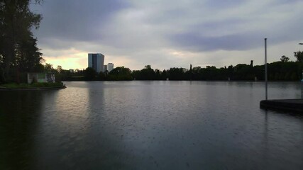 Flying over the lake in rainy afternoon