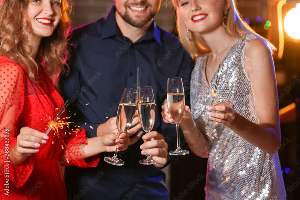 Sticker Young people drinking tasty champagne at party in nightclub