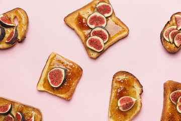 Tasty sandwiches with sweet fig jam on color background