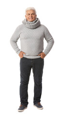 Fototapeta premium Mature man in winter clothes on white background