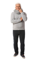 Mature man in winter clothes on white background