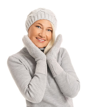 Mature woman in winter clothes on white background