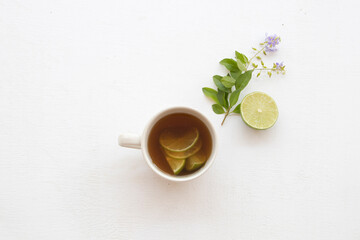 herbal honey lemon tea healthy drinks health care for sore throat with lemon slice with purple...
