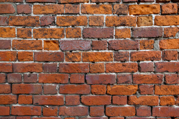 Red brick shabby wall
