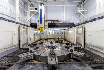 large CNC metal milling machine in the interior of a Metalworking plant.
