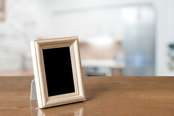 photo frame on the wooden table