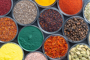 Assortment colorful spices, seeds and herbs for cooking food, top view