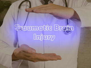 Medical concept meaning Traumatic Brain Injury with sign on the piece of paper.
