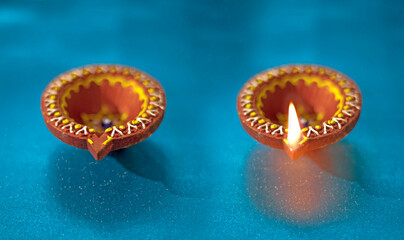 Beautiful clay diya lamps lit during diwali celebration