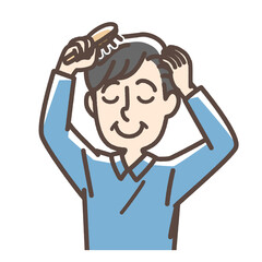 くしでなじませる男性