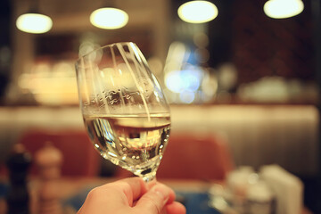 glass white wine restaurant interior, abstract evening dinner with alcohol at the bar