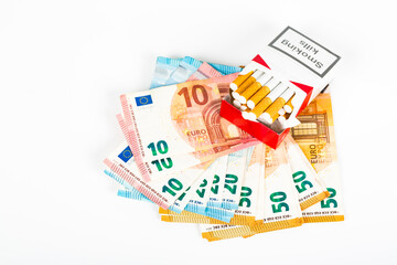 Euros Money notes one hundred and cigarettes box Malboro on white background