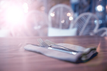 serving in the restaurant, fork and knife / interior view of the restaurant with a table served...