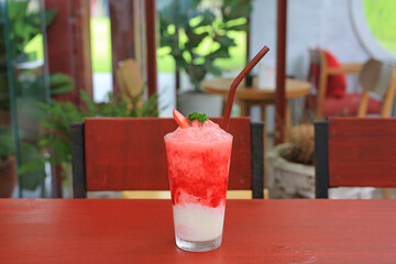 Strawberry smoothie on the table at cafe.