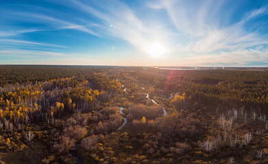 Aerial drone view of autumn landscape with river.