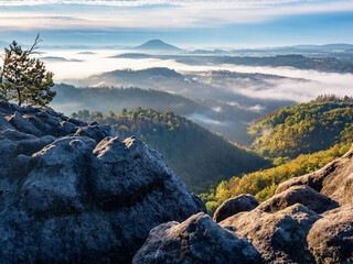 Obraz premium Morning september landscape with first mist in valley