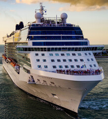 Big white modern cruiseship or cruise ship liner sail away departure from Key West, Florida during...