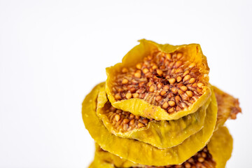 slices of dried figs on a white background. dried fruits. eco. macro.