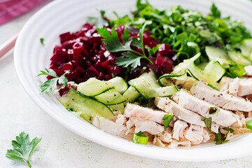 Trendy salad. Chicken boiled fillet with salad beetroot and cucumber. Healthy food, ketogenic diet, diet lunch concept. Keto/Paleo diet menu.