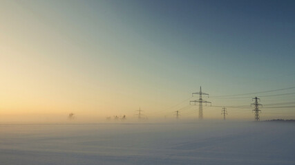 towers in snow with sunrise  