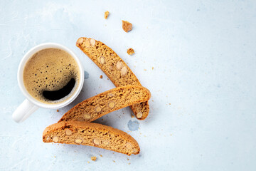 Biscotti. Traditional Italian almond cookies with a cup of coffee, shot from the top with a place for text