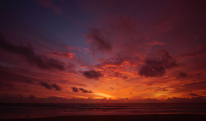Nature background. Shot of Landscape amazing of red sky sunset in the sea with red clouds...