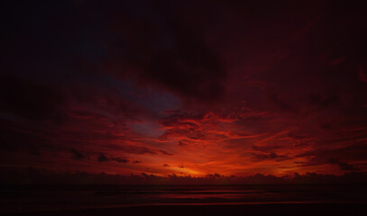 Nature background. Shot of Landscape amazing of red sky sunset in the sea with red clouds...