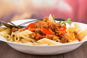 fine pasta with minced meat and tomato sauce and vegetables
