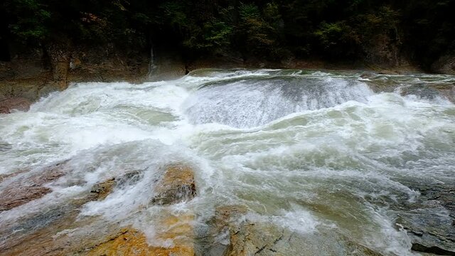 A slow motion of a large water stream that flows noisily in a huge rocky environment, Fukiware Falls is often called "Japan's version of Niagara Falls", next to Numata, near Nikko National Park, Japan