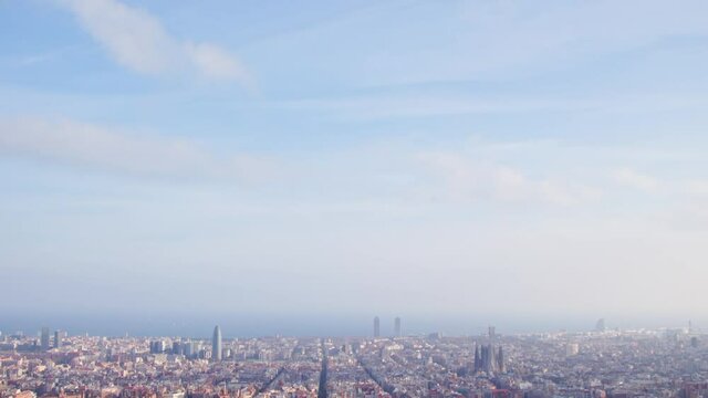 reveal view of barcelona city from bunkers viewpoint during sunny day. Famous mediterranean destination in catalonia spain