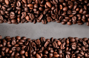 Coffee beans frames at dark gray background. Copy space 