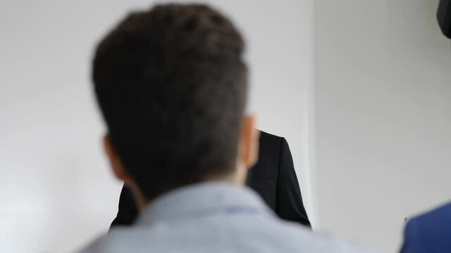 managerial refresher course-businessman educates young managers