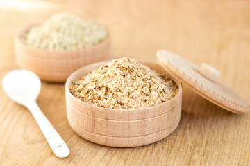 kitchen sea salt with spices in a wooden bowl, healthy nutrition, a concept of kitchenware made from natural materials