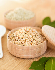 kitchen sea salt with spices in a wooden bowl, healthy nutrition, a concept of kitchenware made from natural materials