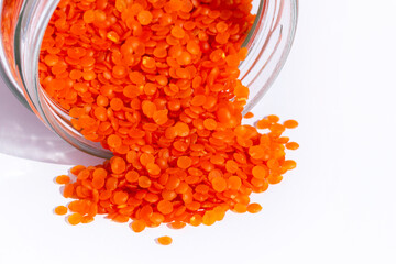 red lentils on a white background