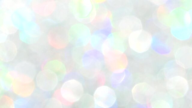 Abstract background of blurred rainbow color glitter, twinkle light, lens flare