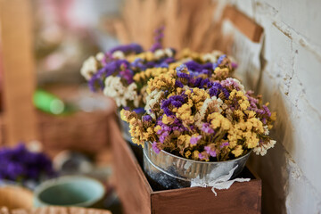 Colorful dry flowers bouquet in bucket
