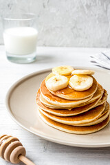 cooked pancake on plate at wooden background