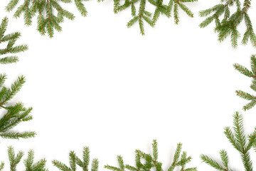 Frame made of fir branches on a white background. Natural composition with copy space.