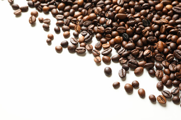 Roasted coffee beans on white background, space for text