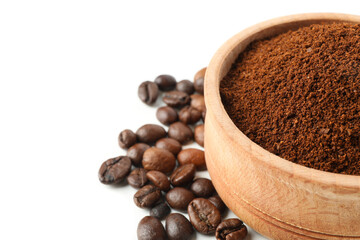 Wooden bowl with ground coffee isolated on white background