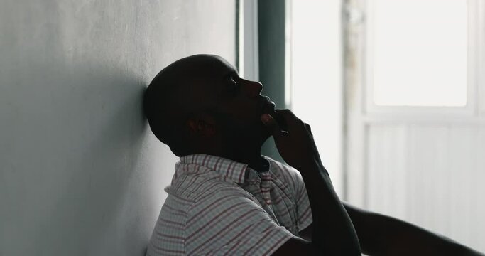 Pensive black african man thinking deeply about solution