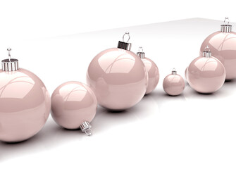 close-up of pink christmas baubles on white