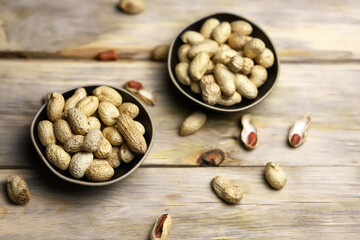 Selective focus. Soft focus. Peanuts in shells in a bowl. Peanut.
