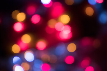 background with lantern lights and garlands. Bokeh and blur effect. Defocused. Christmas, New year and other holiday moods.
