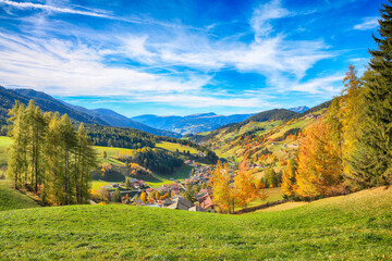 Fototapeta na wymiar Marvelous autumn scene of magnificent Santa Maddalena village in Dolomites