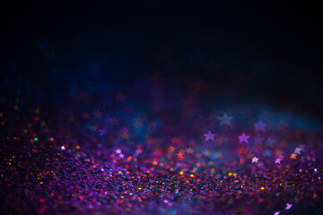 Decoration bokeh lights background, abstract blurred backdrop with stars, modern design wallpaper with sparkling glimmers. Purple, blue and pink backdrop glittering sparks with blur effect - 388470094