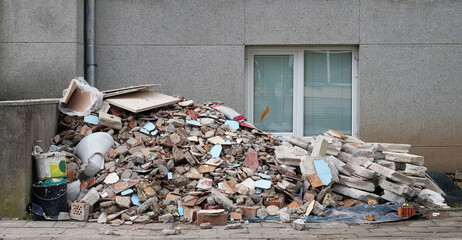 Construction site  debris  heap near old school